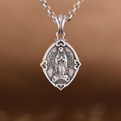 Sterling Silver Virgin Mary Pendant Charm, Religious Jewelry, Miraculous Medal, Virgin Mary Jewelry, Catholic Pendant, Virgin Mary Medal (Not Including Chain) Material: 925 sterling silver Weight: 8.6g * We guarantee 100% genuine 925 Sterling Silver, If not we will refund your money. Care Instruction : 1. Avoid contact with all liquids and chemicals, such as perfume, sea water, mayonnaise, ammonia, chlorinated pool water, hair spray and sweat. Contact with these substances will increase the rate Sterling Silver Miraculous Medal Jewelry, Silver Miraculous Medal Round Pendant, Silver Jewelry With Miraculous Medal For Gift, Sterling Silver Miraculous Medal Necklace As Gift, Silver Necklace With Miraculous Medal For Jewelry Making, Sterling Silver Round Pendant For Anniversary, Symbolic Miraculous Medal Jewelry As Gift, White Gold Miraculous Medal Jewelry In Sterling Silver, Vintage Miraculous Medal Jewelry