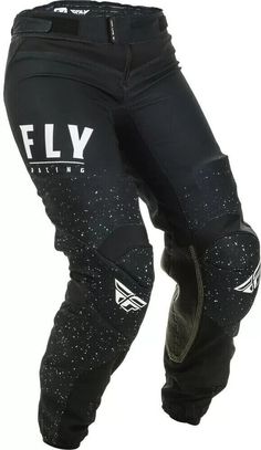 the fly racing pants are black with white speckles on them and one leg is visible