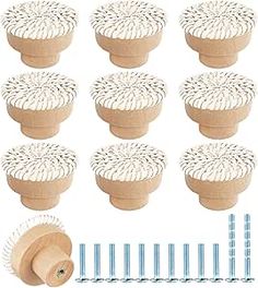 twelve wooden knobs with spikes and pins for sewing or crafting on white background