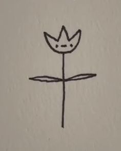 a drawing of a cross with a flower on it