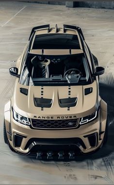 the front end of a beige sports car