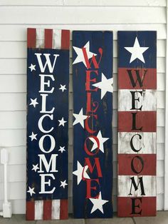 three wooden signs with the words welcome, welcome home and welcome america written on them