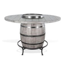 an outdoor table with a wine barrel on it