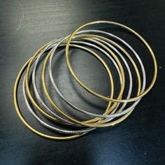 Semi solid form, hollow made with 100% 14K Yellow gold. 11.5g in total Gold Polished Hoop Bracelets, Gold Hoop Bracelets With Polished Finish, Metal Bangle Bracelet With Shiny Finish, Shiny Metal Bangle Bracelet, Shiny Metal Bangle Bracelets, Metal Bangle Bracelets With Shiny Finish, Silver Bangle In 14k Gold, Silver 14k Gold Round Bangle, Stackable Round Gold Bracelet