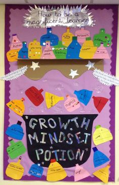 a bulletin board with writing and magnets on it that says growth minds potty