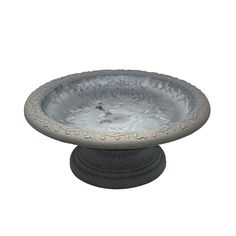 a metal bird bath sitting on top of a pedestal with an ornate design around the rim