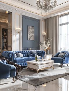 a living room filled with blue couches and a chandelier hanging from the ceiling