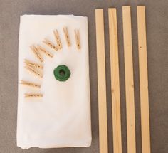 the wooden dows are being used to make popsicle sticks and yarn ball holders