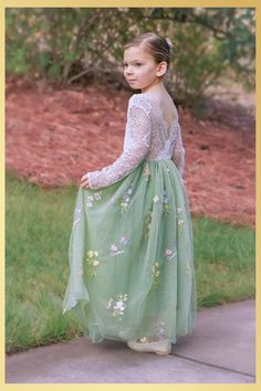 Sage Floral Embroidery Flower Girl Dress Looking for the perfect flower girl dress for your wedding or special occasion? This stunning sage green floral embroidery dress exudes elegance with its intricate designs and sage tones. Your flower girl will be the epitome of grace and charm as she makes her way down the aisle in this captivating creation. The dress features a soft lace bodice with an open V shaped lace trimmed back. The long flowing tulle skirt is lined and has layers of tulle and deep ruffle hemline giving it a mermaid feel. No little girl with be able to resist giving this dress a twirl as this dress just flows with extra amounts of volume. It is perfect for twirling. This dress can be used for many events think weddings for your flower girl, a dress for Easter, a daddy daughte Floral Flower Girl Dress, Sage Flower Girl Dress, Elegant Wedding Themes, Long Flower Girl Dresses, Floral Embroidery Dress, Sage Green Dress, Sage Green Floral, Infant Flower Girl Dress, Sage Dress