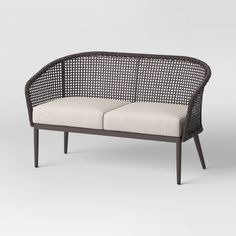 an outdoor bench with two cushions on it and one seat upholstered to the side