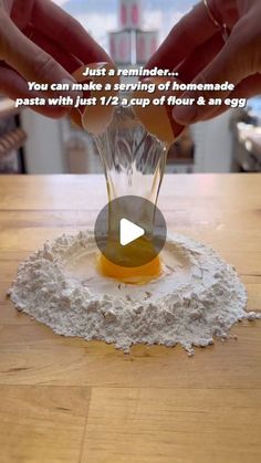 someone is pouring flour into a glass vase on top of a wooden table with the words, just a reminder you can make a serving of homemade pasta with just 1 / 2 cups of flour and an egg