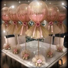 there are many balloons that have been placed on the table for someone's special occasion