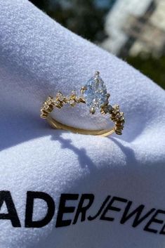 a close up of a diamond ring on a towel