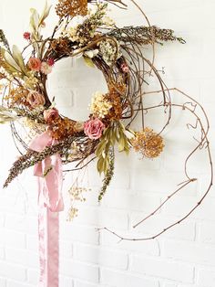 Elegant 24-Inch Dried Floral Wreath Transform your home with our stunning 24-inch wreath, artfully crafted from dried and preserved roses, hydrangeas, and a delightful mix of garden florals. This natural and airy display is a timeless piece, perfect for adding a touch of elegance to any space. Key Features: Premium Quality: Made from carefully selected dried and preserved roses and hydrangeas, ensuring lasting beauty. Natural Design: A harmonious blend of garden florals creates a serene and sophisticated look. Versatile Decor: Ideal for any season, this wreath brings a charming, rustic touch to your wall or mantel. Due to its delicate elements we suggest using the wreath indoors only. Elegant Finishing: Adorned with a luxurious draping silk ribbon, adding a graceful and refined touch. Enha Dry Flower Wreath, Dried Floral Wreath, Dried Floral Wreaths, Roses And Hydrangeas, Dried Flower Wreaths, Flower Wreaths, Preserved Roses, Floral Wreaths, Bouquet Arrangements