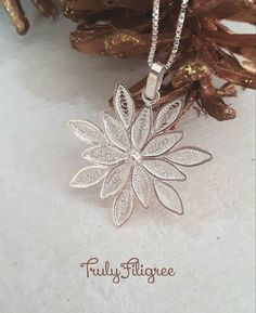 A dainty and unique handmade silver filigree snowflake pendant which would make a lovely gift for someone special. Measurement 3.00 cm Please note that items are shiner than shown in photos. This lovely piece of jewelry is worked in the most traditional technique . I used two types of silver wire to make these earrings. A flat wire to form the pattern, and a very fine double wire twisted and flattened for the filigree filling. Items will be sent by registered airmail in a jewellery gift box and Arabic Henna Designs, Quilled Jewellery, Flat Wire, Snowflake Necklace, Filigree Pattern, Snowflake Pendant, Filigree Jewelry, Gift Inspiration, Filigree Pendant