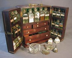 an open wooden box with several bottles in it