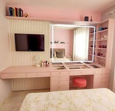 a bedroom with a bed, desk and mirror