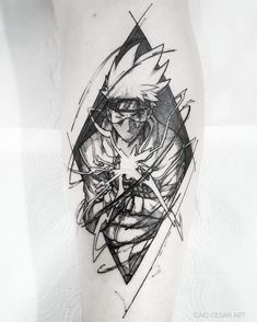 a man's leg with a black and white tattoo design on the side of his leg