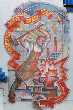 a mural on the side of a building with a man holding a baseball bat in his hand