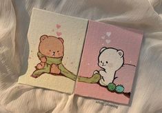 two small cards with teddy bears on them sitting next to each other in the bed