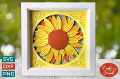 a paper cut sunflower in a frame on a wooden table with the text svg dxf file