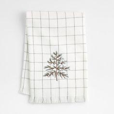 a white towel with a christmas tree on it