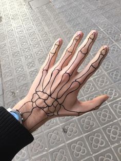 a person's hand with black lines on it