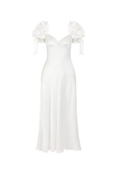 The Poet Slip, a silk charmeuse maxi dress cut on the bias for an impeccable fit, drapes elegantly over the body, creating a graceful and dreamy silhouette. The luminous ivory silk, bone white and smooth as porcelain, features puff sleeves and soft cups, with charming silk bows at the shoulder and cuff. Stunning for a romantic elopement in a sun-dappled Tuscan vineyard or an intimate ceremony in a botanical garden. Bias-cut silk charmeuse slip dress with soft cups and bow details No underwire Pu White Selkie Dress, Bridal Midi Dress, Selkie Bridal, Rehearsal Dinner Dress For Bride, White Prom Dress Mermaid, Elopement Outfit, White Puff Sleeve Dress, Plain White Dress, Tuscan Vineyard