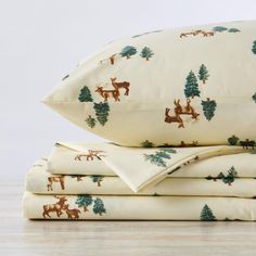 sheet set with deer and pine trees on them