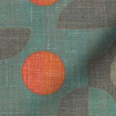 an orange and green fabric with circles on it