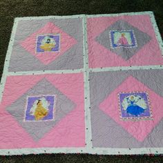 a quilted blanket with pictures of princesses on the front and back squares in different colors