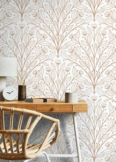 a chair and table with a clock on it in front of a wallpapered background