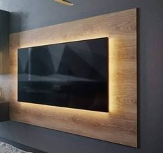 a large flat screen tv mounted to the side of a wall