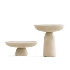 two white pedestals sitting next to each other