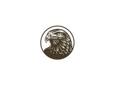 an eagle head in a circle on a white background