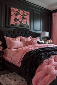 a bed with pink and black comforters in a bedroom