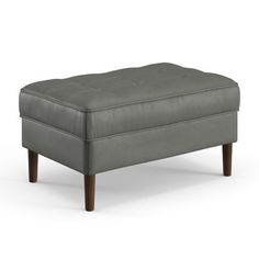 a gray ottoman with wooden legs on a white background