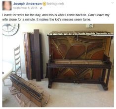 an old piano sitting on top of a floor next to other pieces of furniture in a room