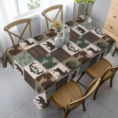 a dining room table covered with a deer print