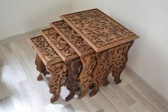 three wooden tables sitting on top of a hard wood floor