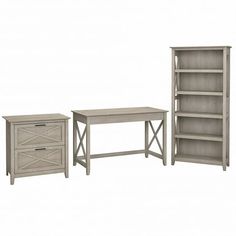 three pieces of furniture including a desk, bookcase and end table in grey wood