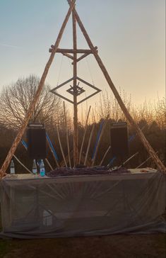 an outdoor stage set up with speakers and sticks