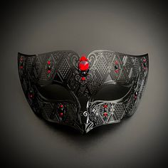 The black mask is alluring, embedded with red rhinestones to make you look glamorous at any function. Red And Black Masquerade Mask, Masquerade Mask Men, Masquerade Masks For Men, Red Masquerade Mask, Mens Mask, Red Masquerade, Mask Ball, Wedding Mask, Mens Masquerade Mask