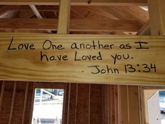 a wooden sign that says love one another as i have loved you john 13 34