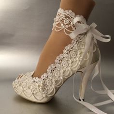 white bridal shoes with lace and bows