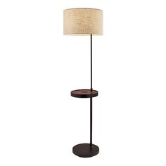 a lamp that is on top of a wooden stand with a light shade over it