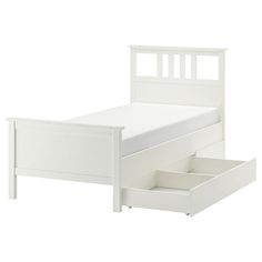 a white bed frame with two drawers on the bottom and one drawer underneath it, in front of a white background