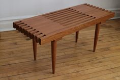 a wooden table sitting on top of a hard wood floor