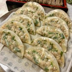 some dumplings are sitting on a plate and ready to be eaten in the oven