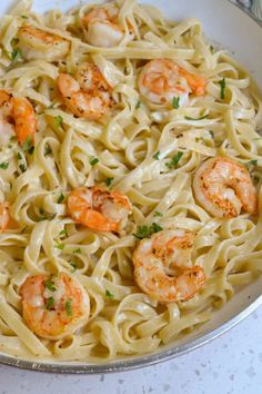 pasta with shrimp and parsley in a pan